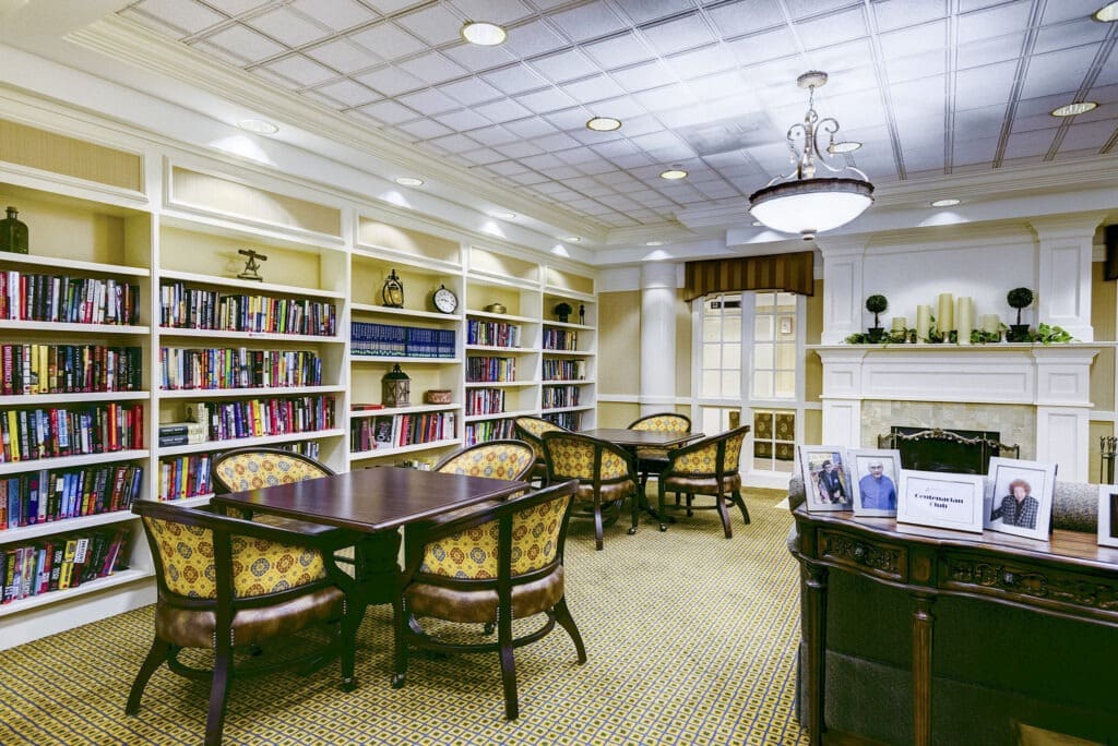 brookdale-northbrook-2-library - Inspirations of Northbrook Inspirations of Northbrook library room with seating and games and tables for socializing.