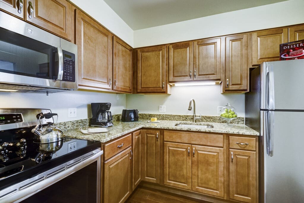 Interior image of a senior living resident's kitchen at Inspirations of Northbrook.